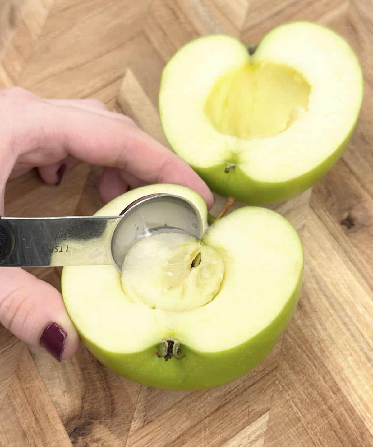 scooping out center of apples.