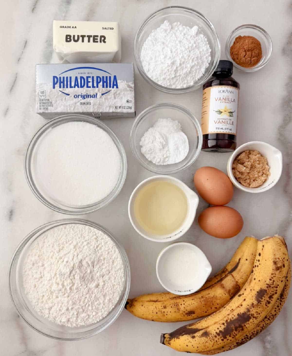 bananas, flour, sugar, oil, cream, eggs, cinnamon, vanilla, cream cheese, butter, salt, baking soda and powder.