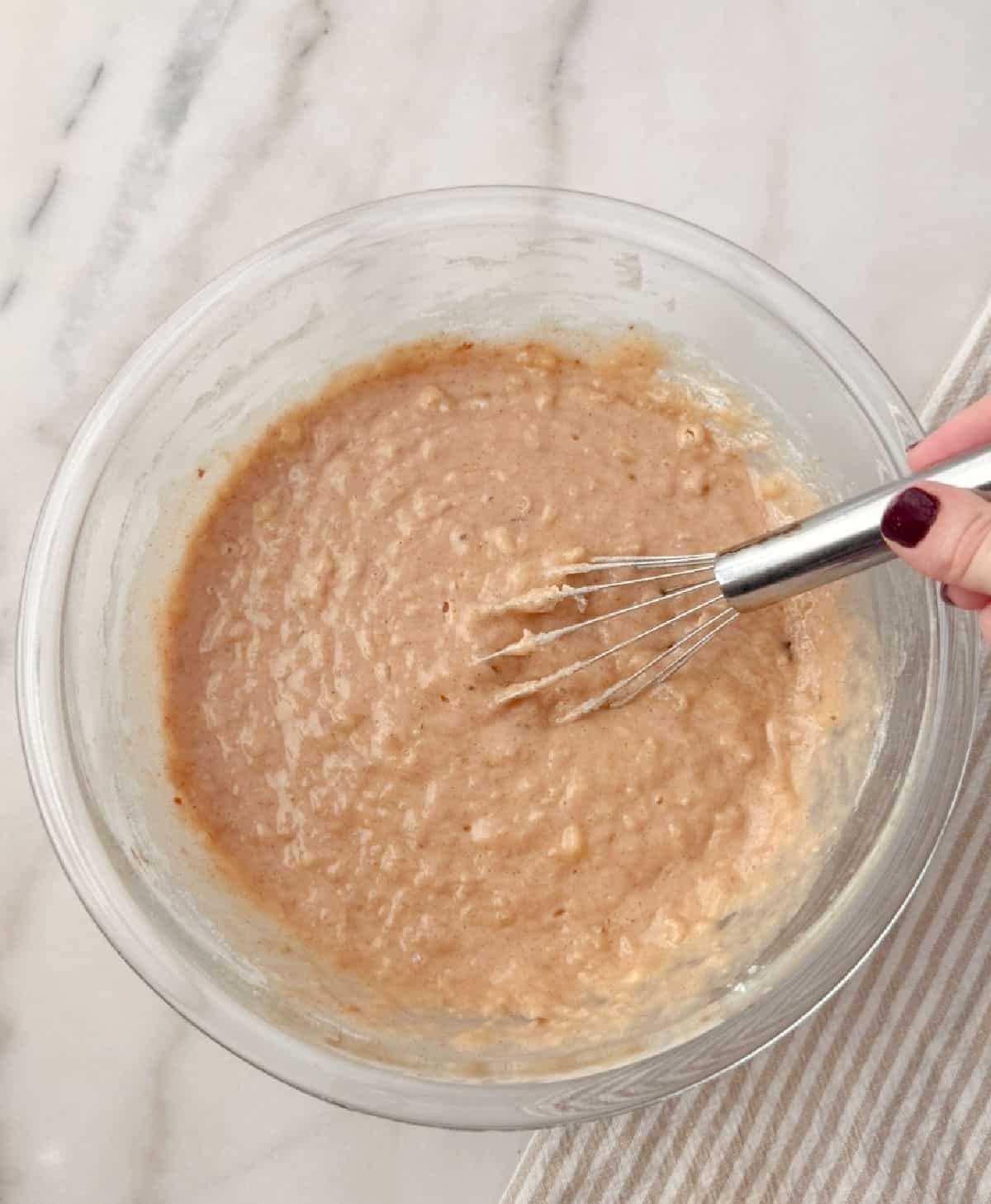 mixing ingredients in glass bowl.