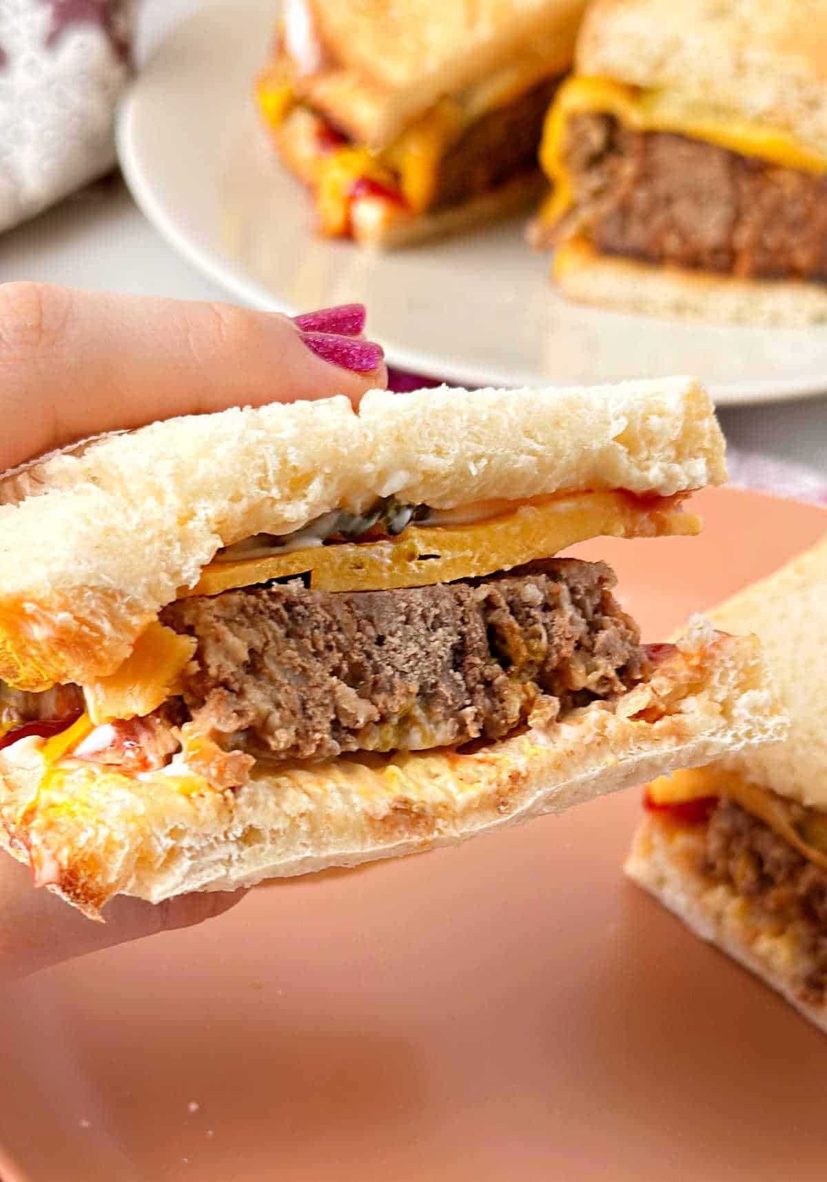 cold meatloaf sandwich with mayo and cheese.