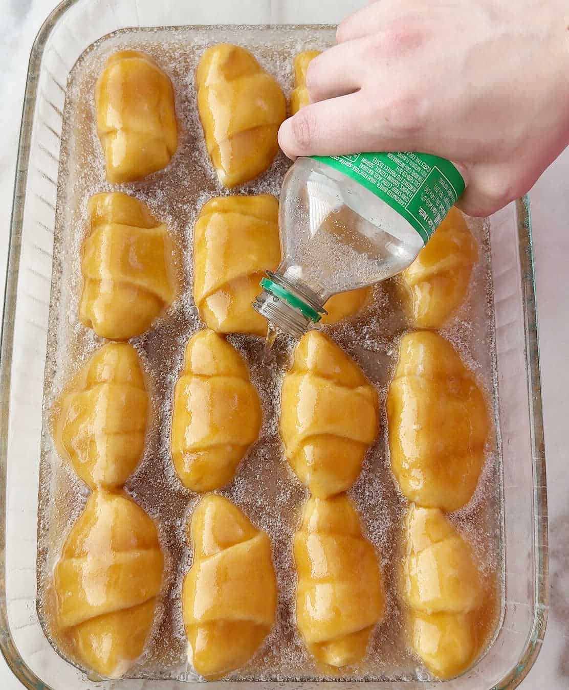 pouring sprite into baking pan.