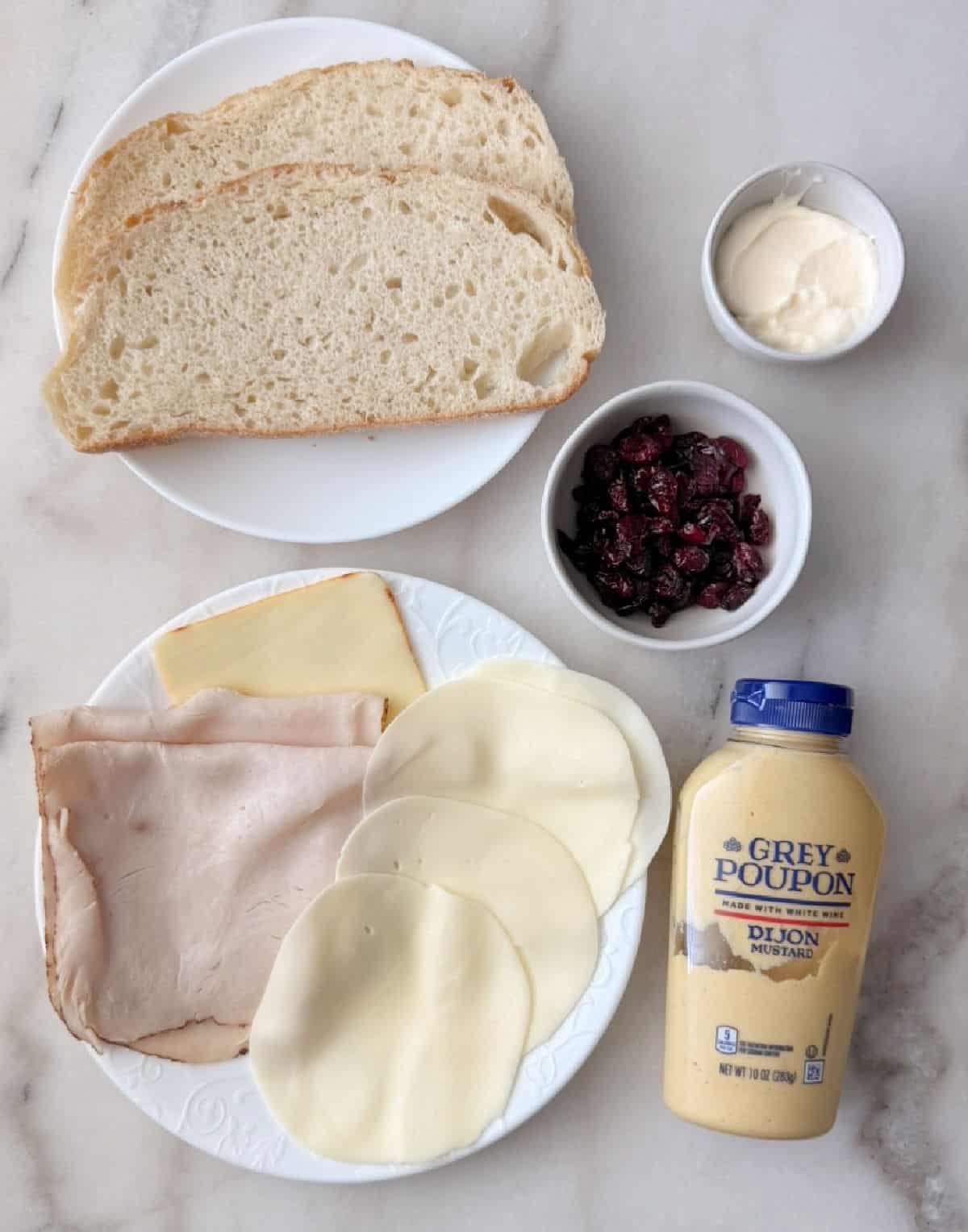 sliced turkey, cheese, sourdough bread, craisins, mayo, mustard