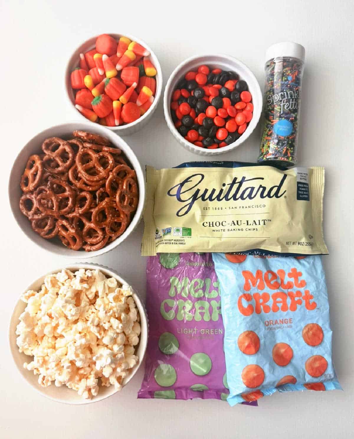 popcorn, candy melts, pretzel twists, candy and white chocolate.
