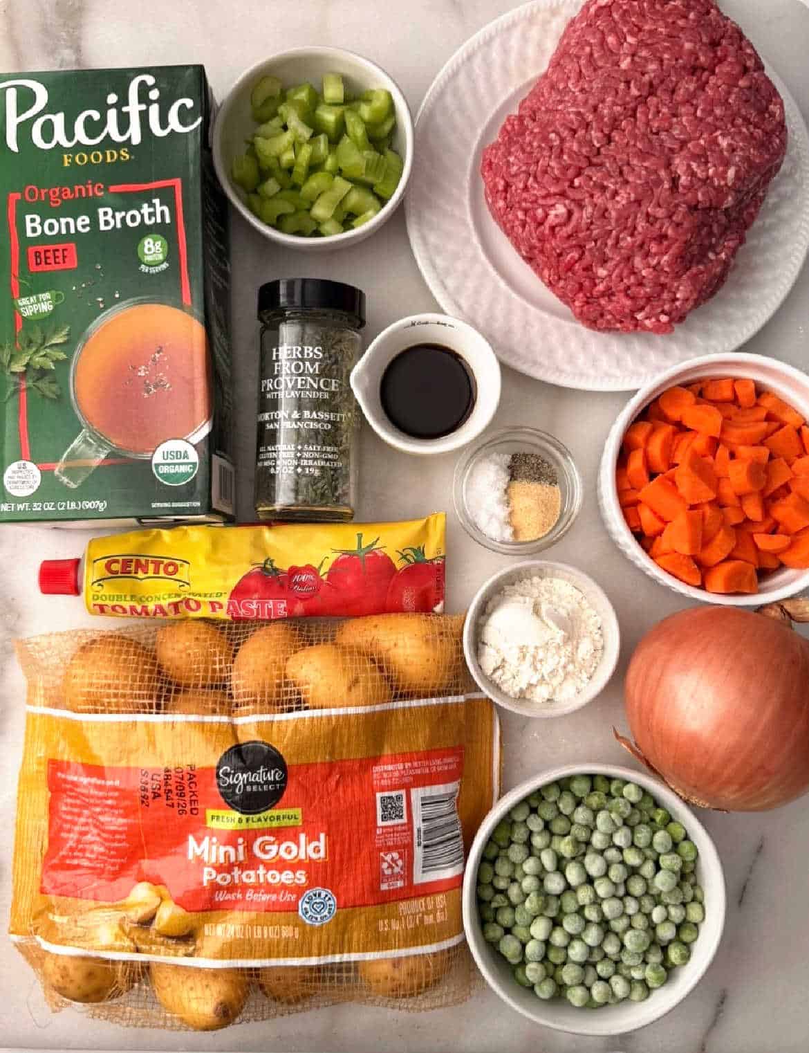ground beef, potatoes, carrots, celery, onion, peas, broth, flour and seasoning.