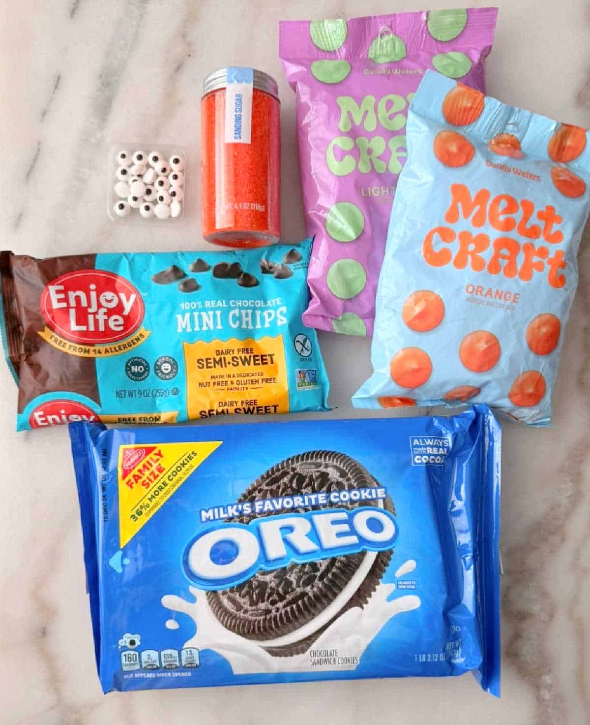 Oreo cookies, candy melts, mini chips and decorations.