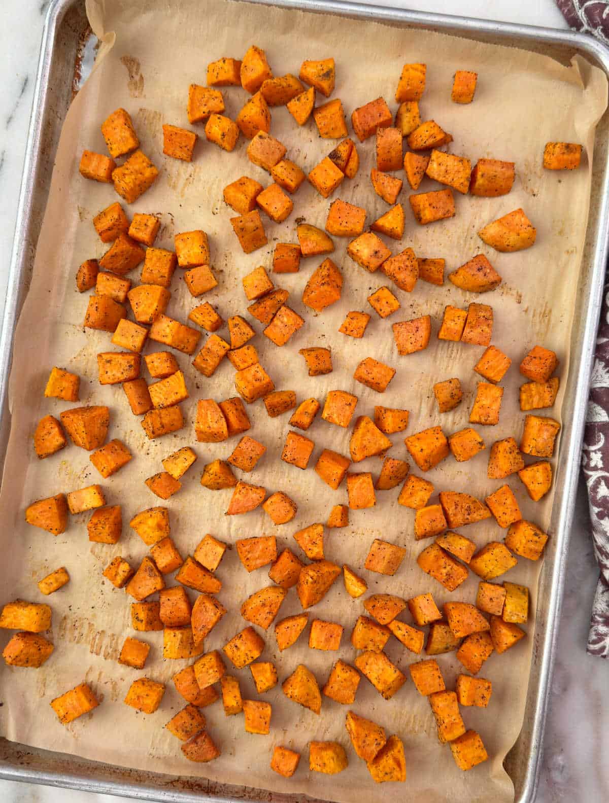 roasted sweet potatoes on baking sheet.