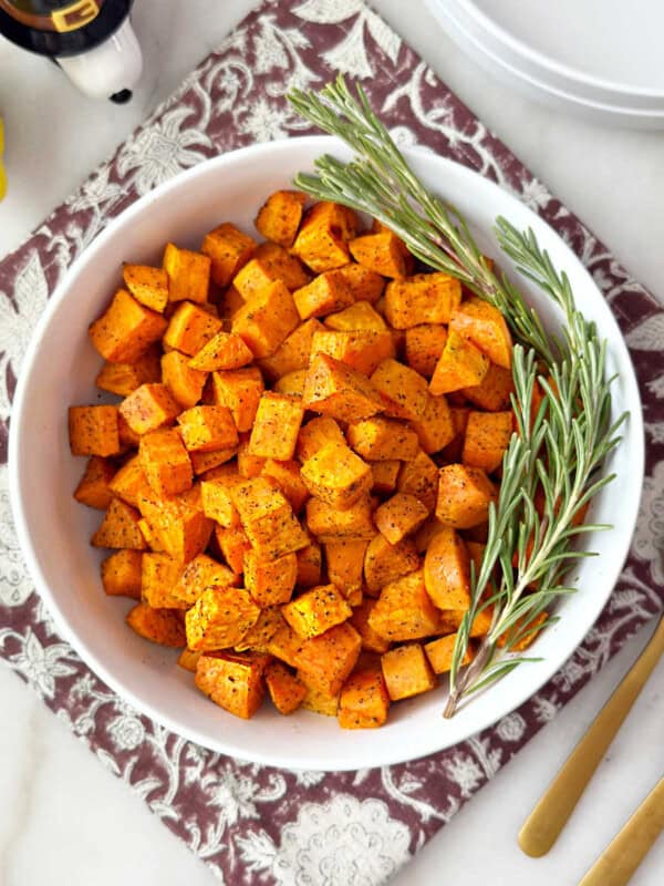 easy roasted sweet potatoes recipe in bowl.