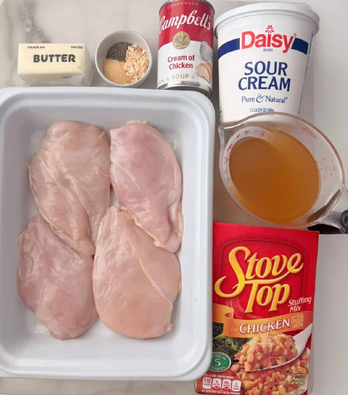 chicken breast, stove top stuffing, sour cream, broth, cream soup, butter, seasoning.