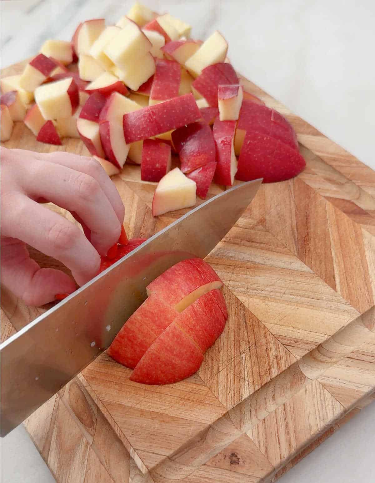 cutting apples on cutting board.