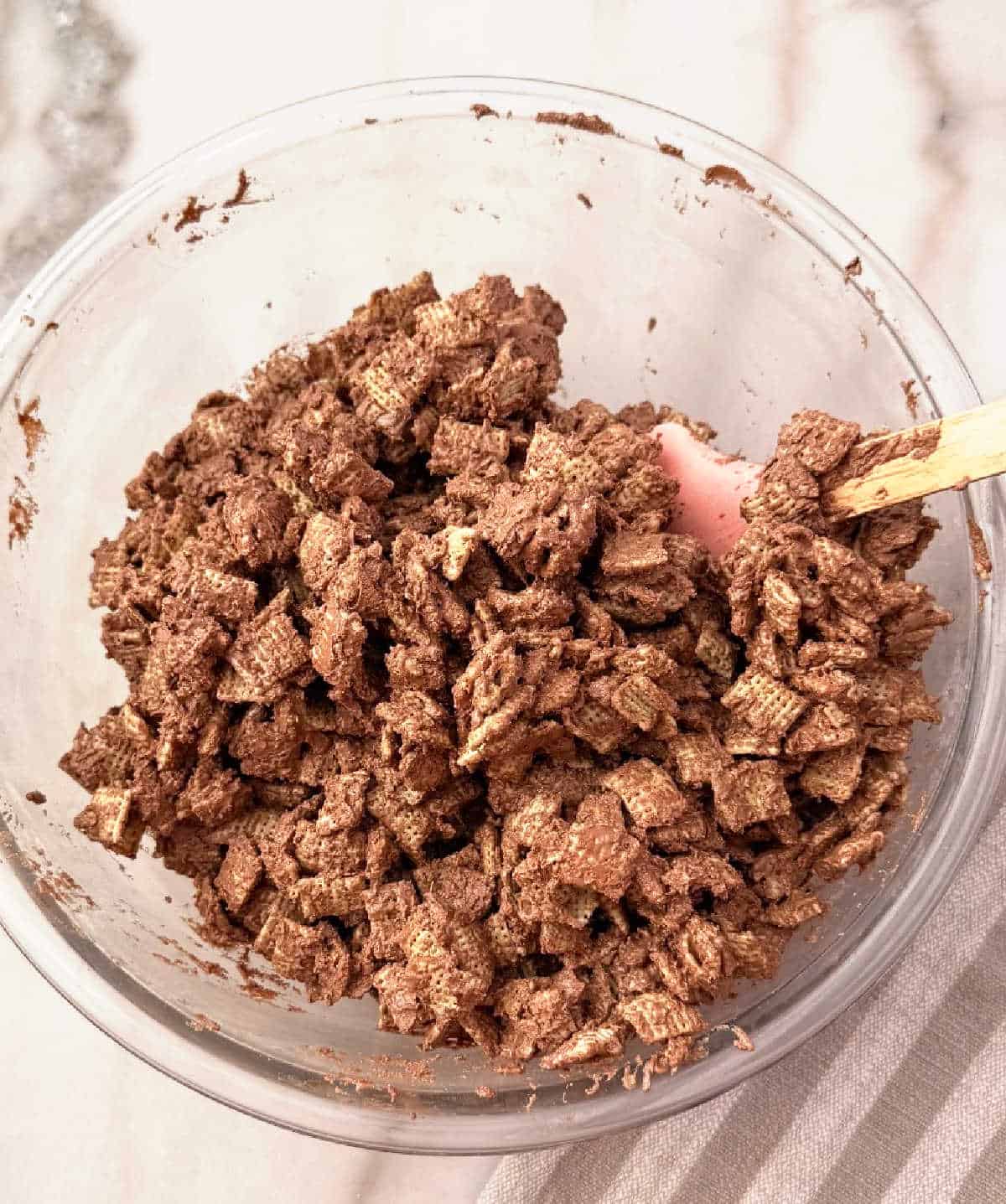 stirring in rice chex.