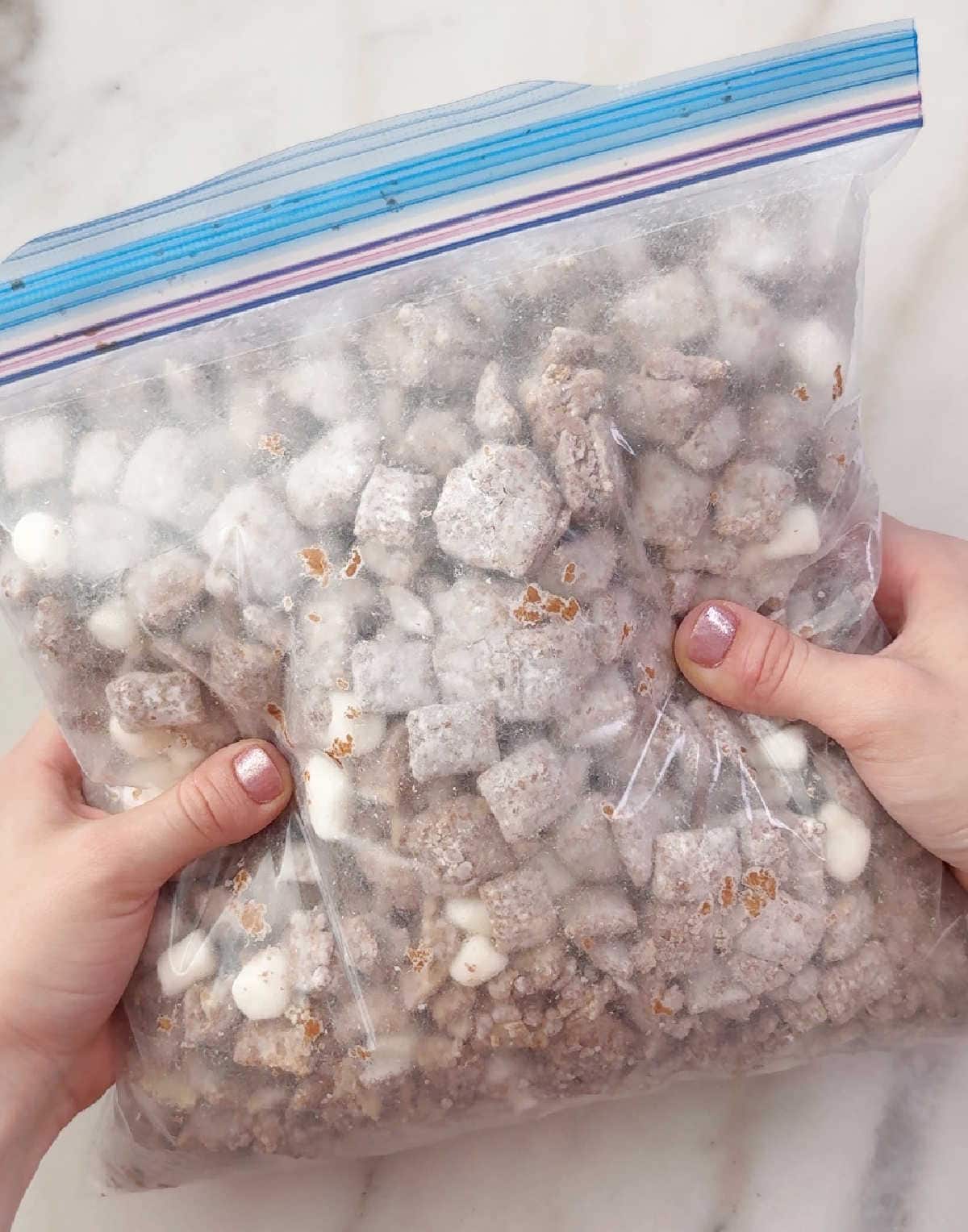 shaking puppy chow in freezer bag.