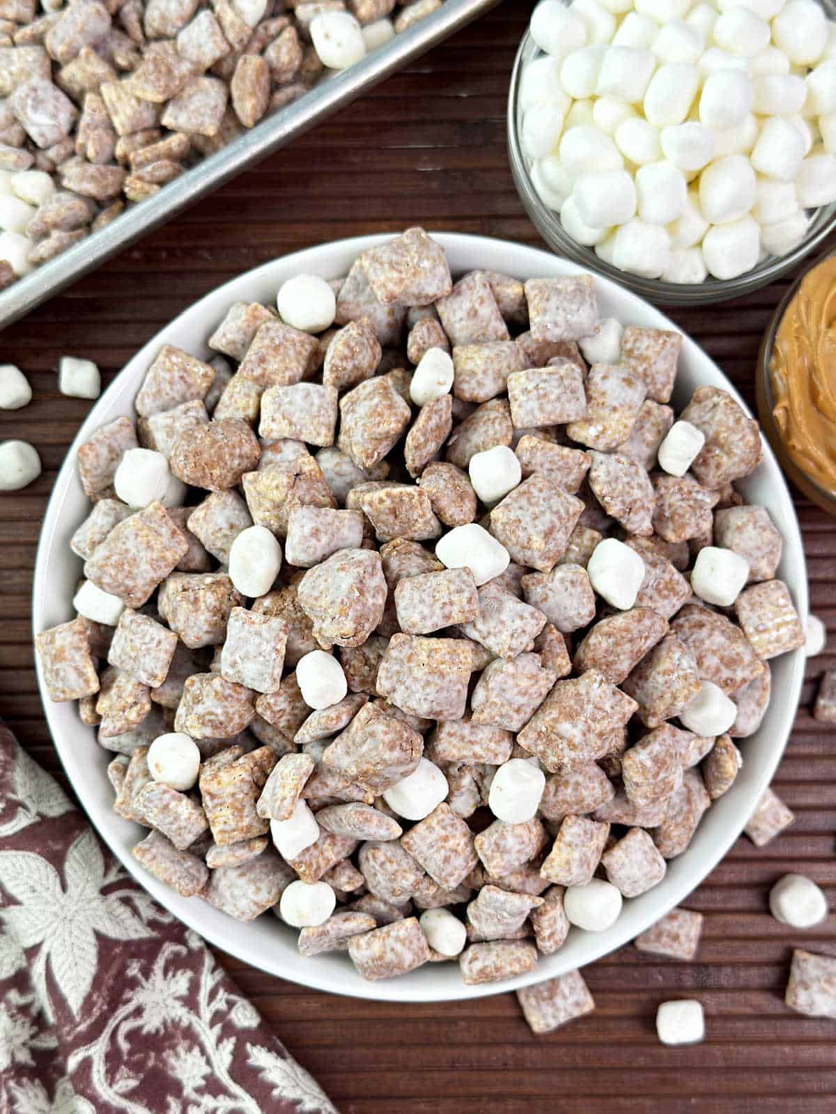 bowl of fluffernutter puppy chow with peanut butter and marshmallows.