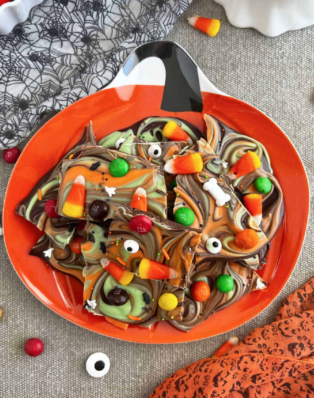 plate of Halloween bark with candy corn and m&m's.