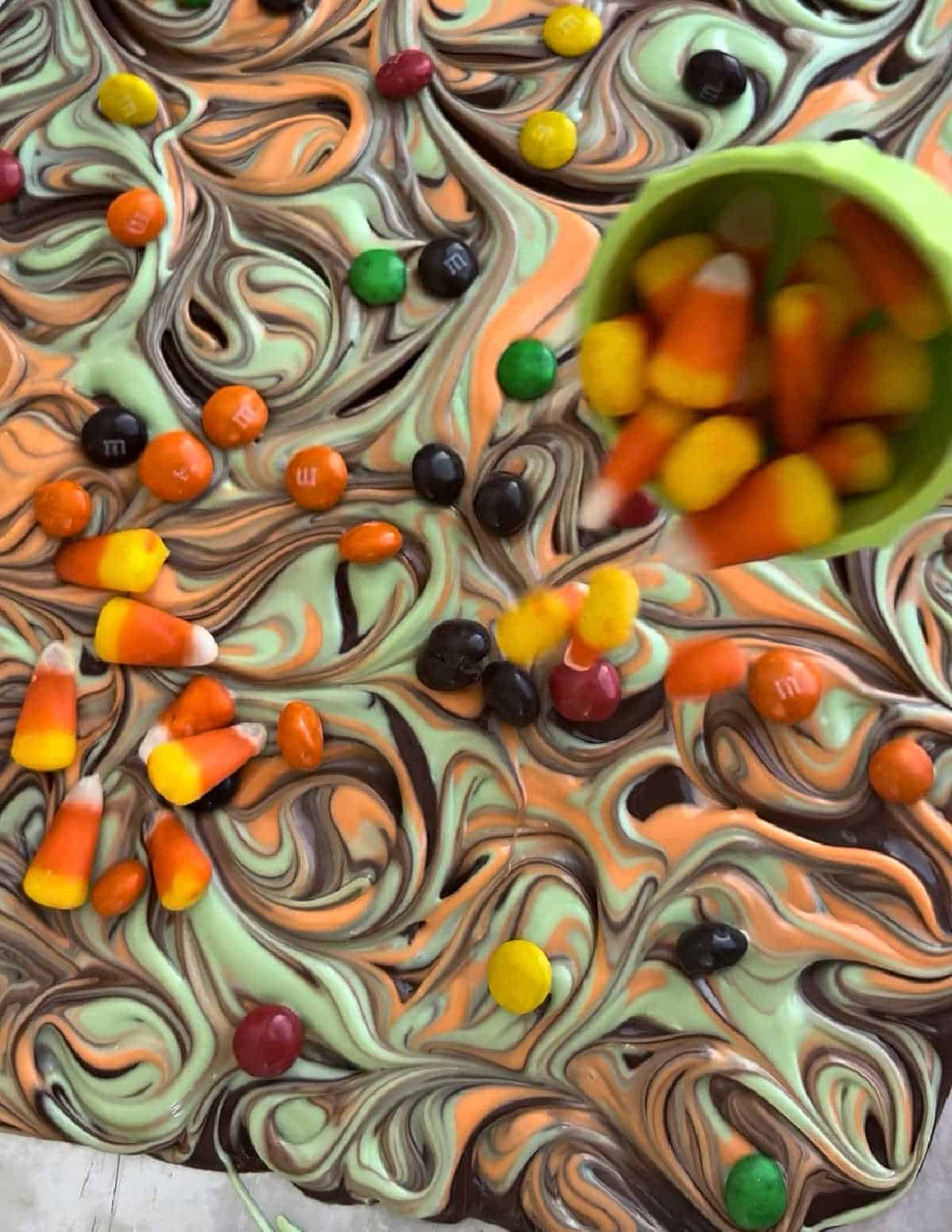 adding Halloween candy to bark.