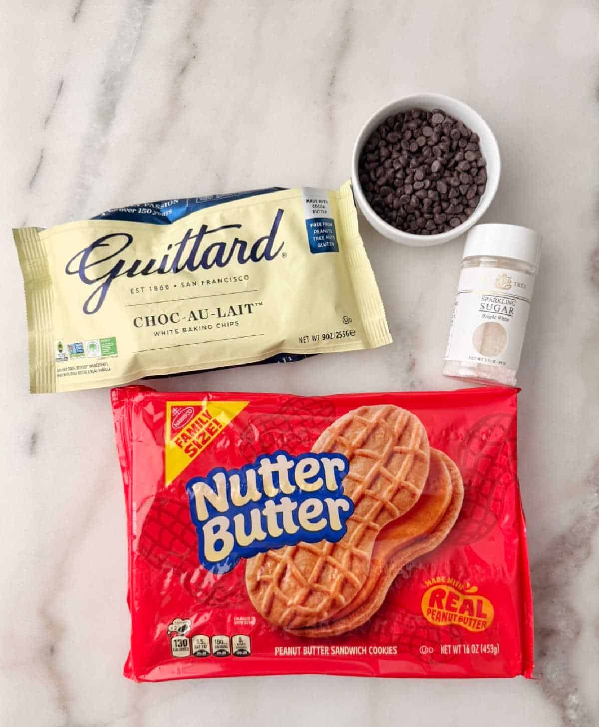 package of Nutter Butter cookies, white chocolate chips, mini chocolate chips, sparkling sugar.