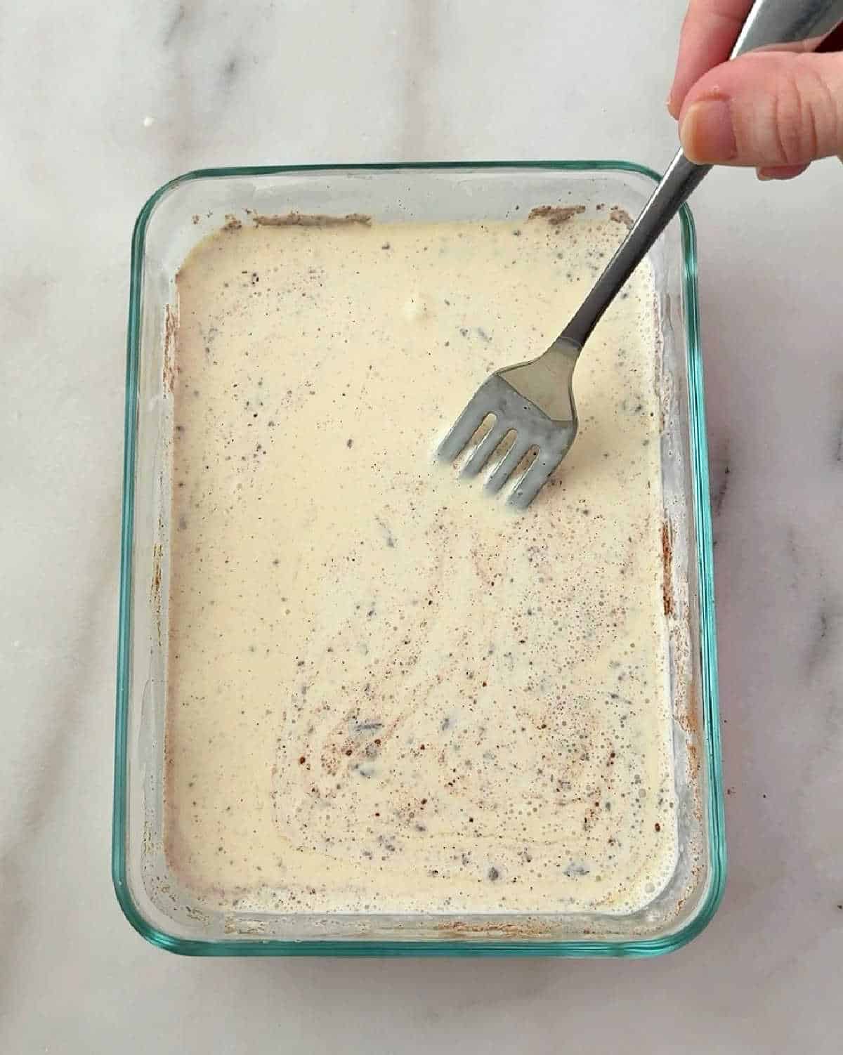 stirring custard with fork.