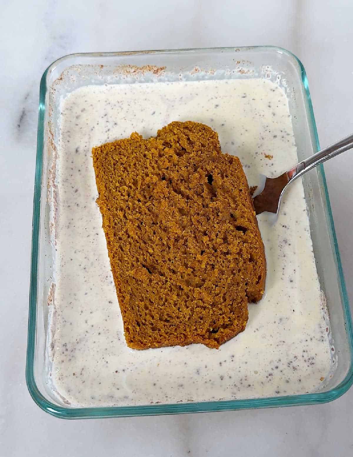 dipping pumpkin bread into custard.