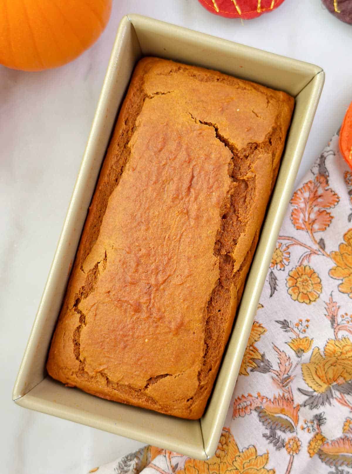 baked pumpkin bread with spice cake mix in pan.