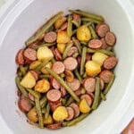 crockpot smoked sausage and potatoes with green beans in slow cooker