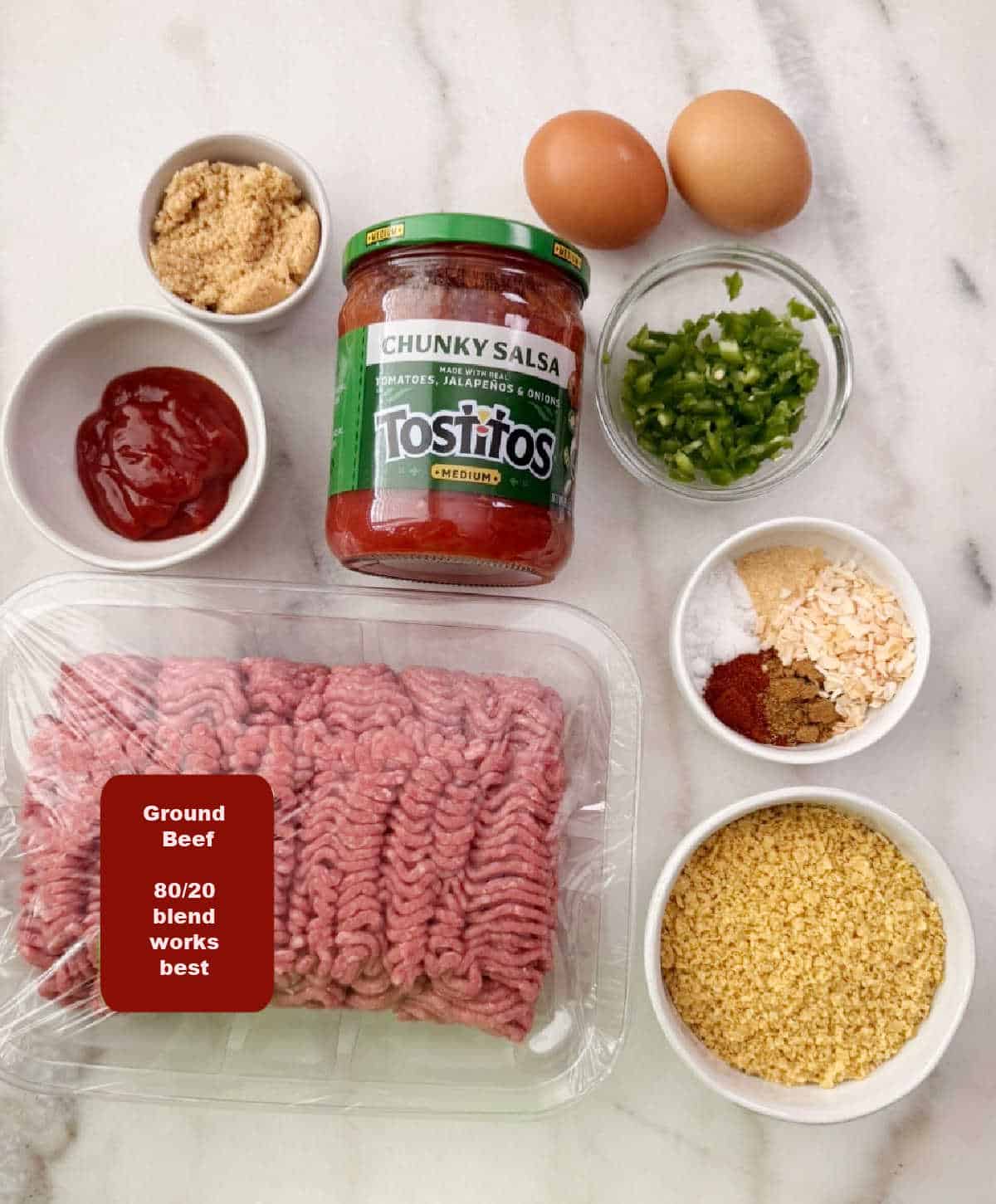 ground beef, eggs, crushed tortilla chips, spices, diced jalapeno pepper, ketchup, brown sugar.