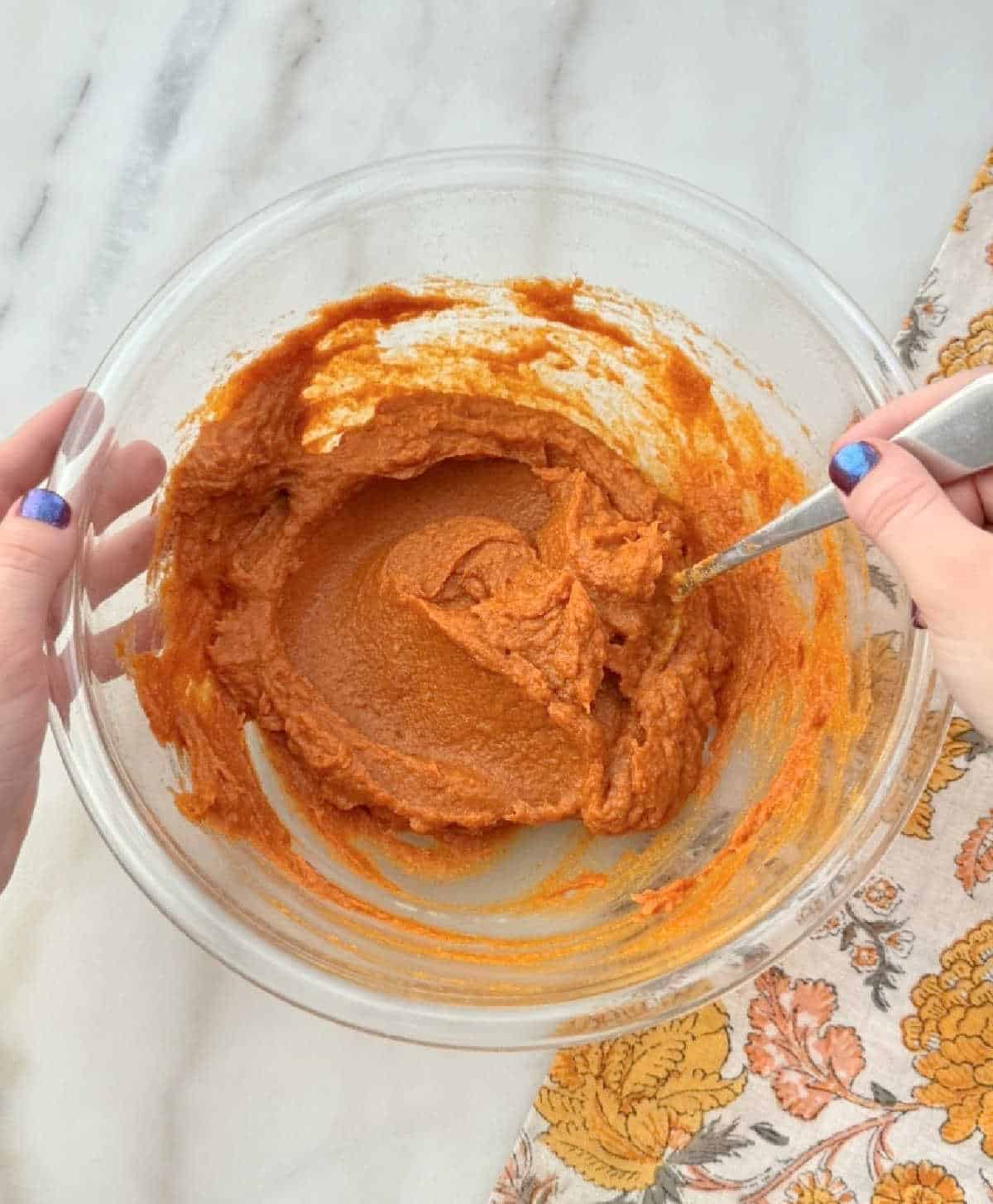 mixing ingredients with spoon.