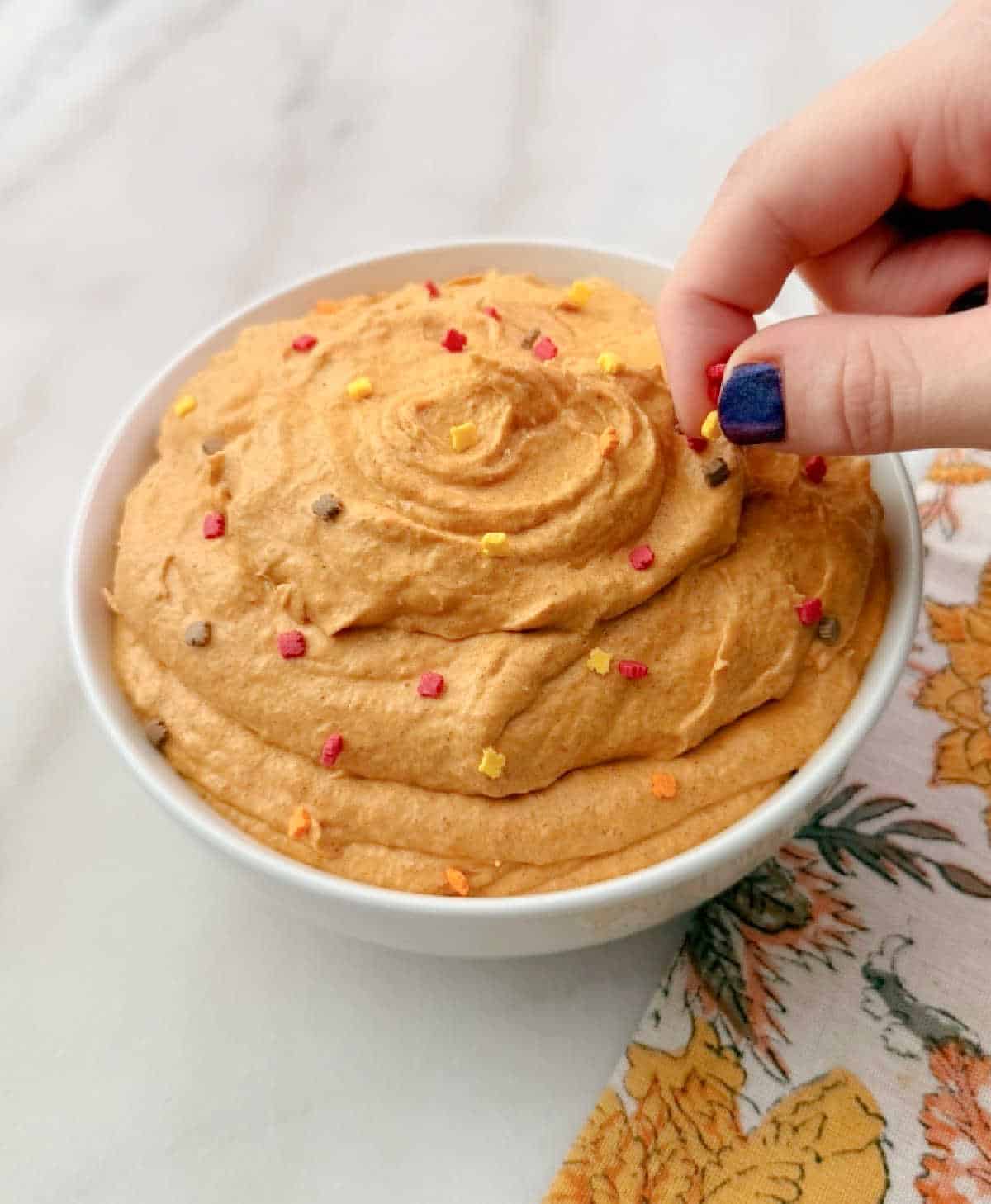 adding sprinkles.