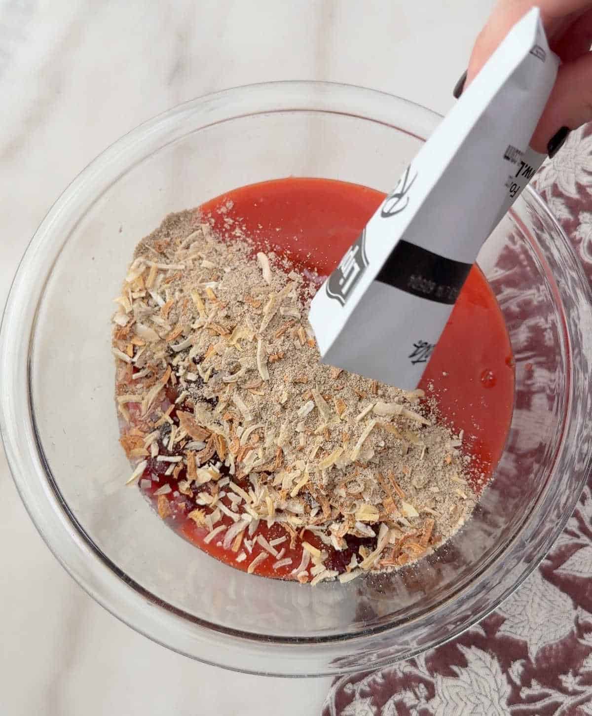 adding sauce ingredients to glass bowl.