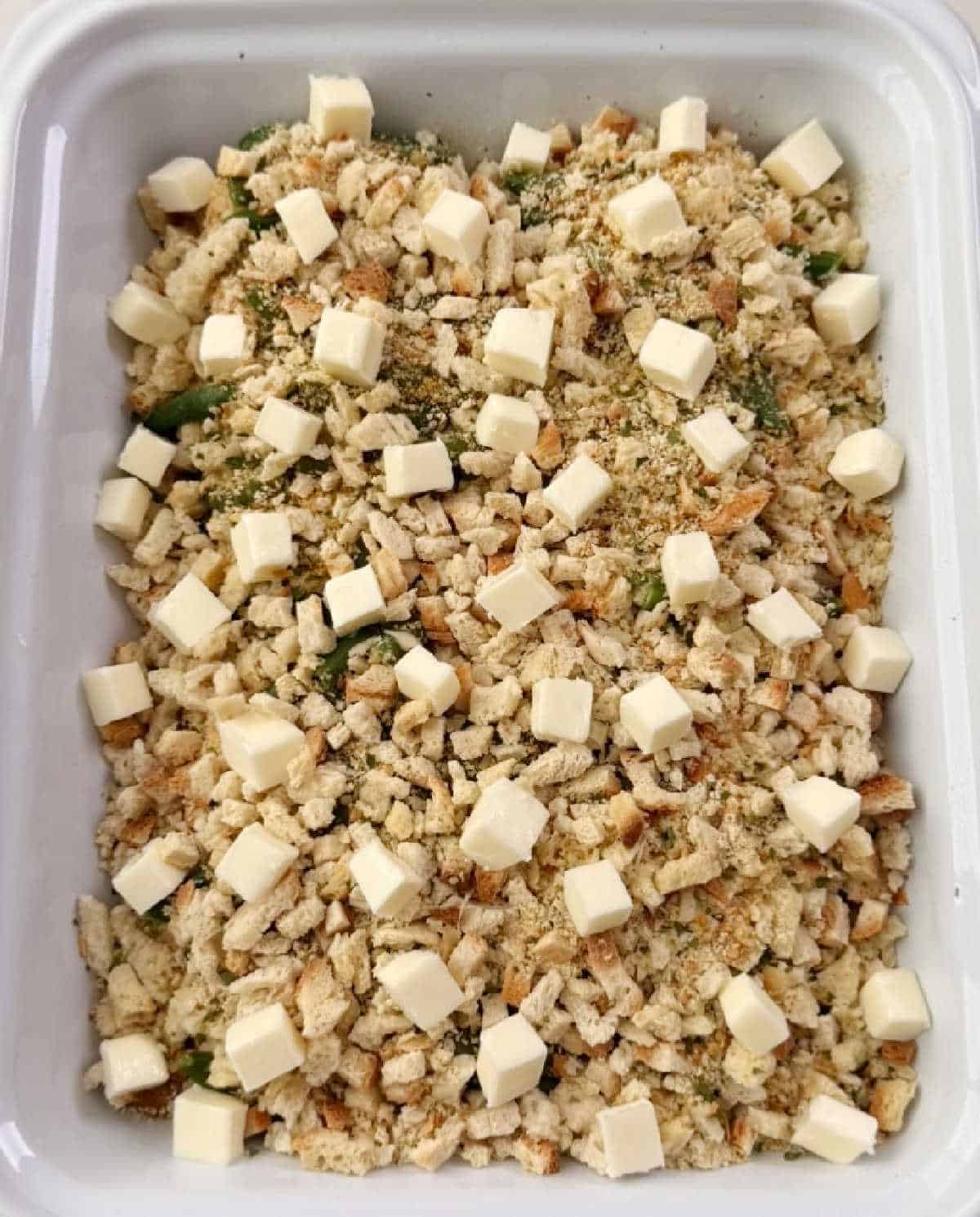 cubes of butter on top of stuffing layer.